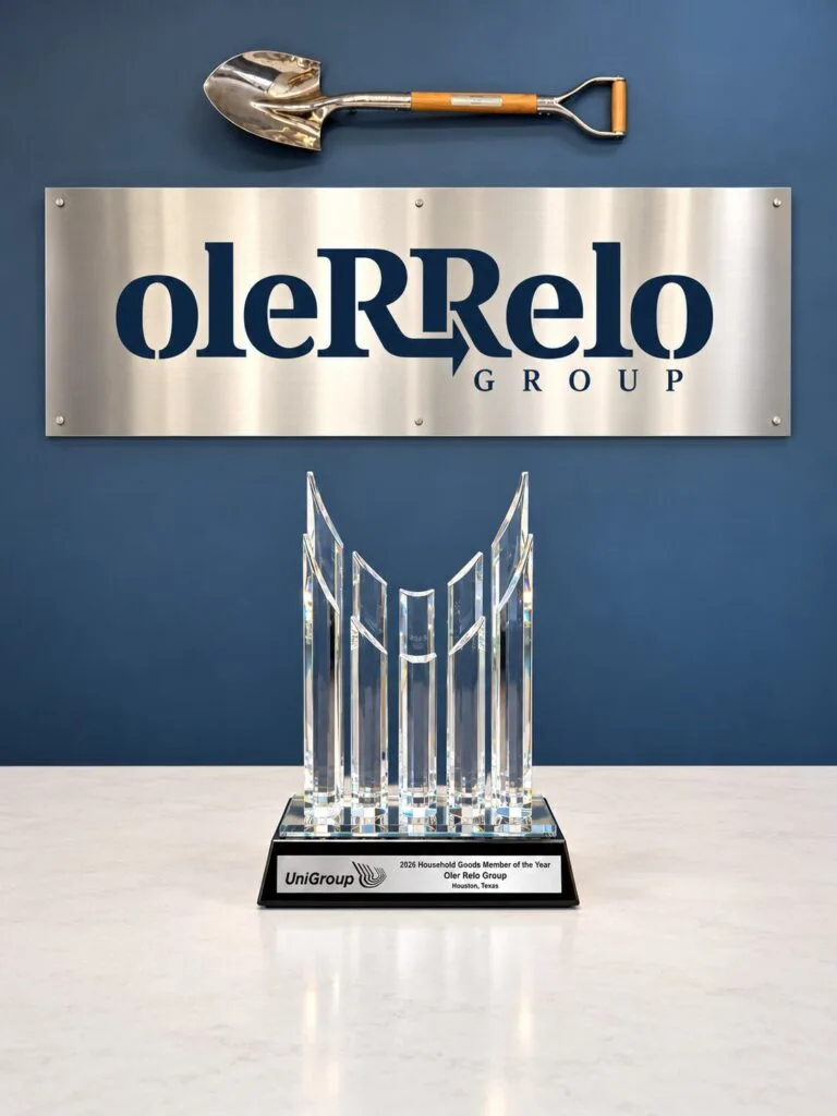 UniGroup's 2026 Household Goods Member of the Year crystal award beneath the Oler Relo Group sign
